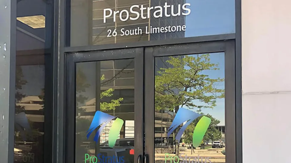 Glass entrance door with ProStratus signage.